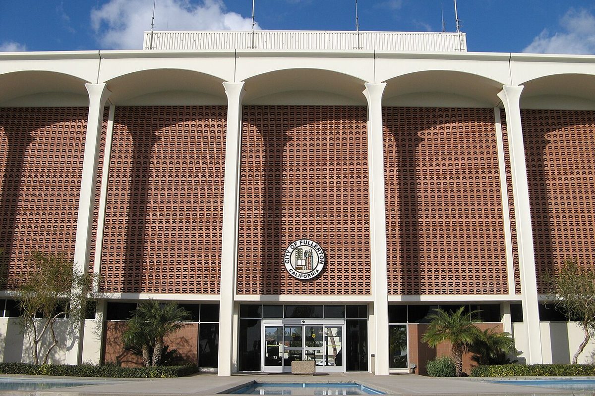 Fullerton City Hall with its arched facade and city seal in Fullerton, California
