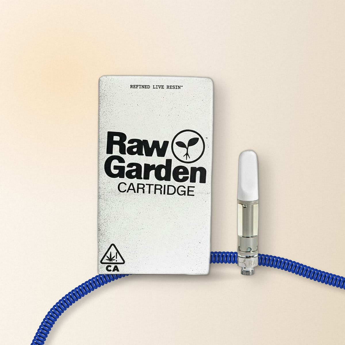 Raw Garden Cap City Kush 1g refined live resin cartridge on cream linen with a cobalt coiled phone cord