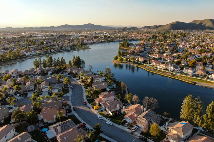 Aerial view of a lake and neighborhood in Riverside County