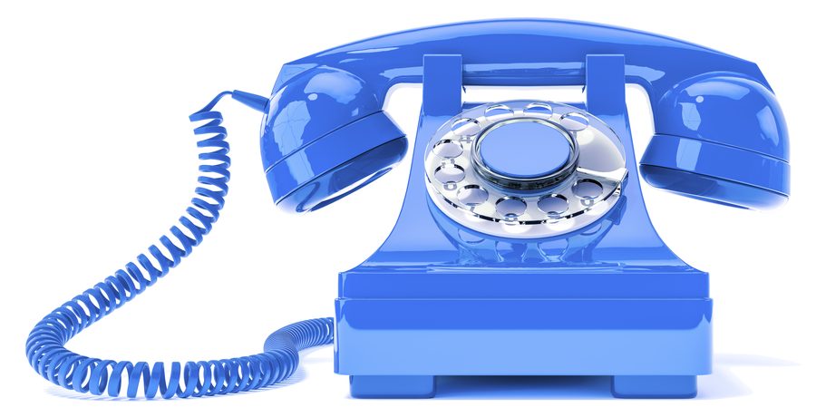 A cobalt-blue rotary telephone with a coiled cord